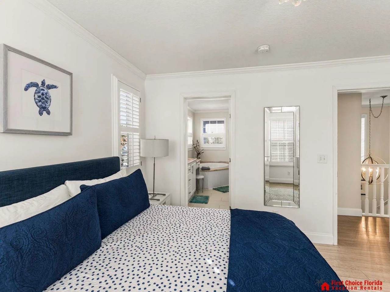 Bright and airy bedroom with cozy navy accents