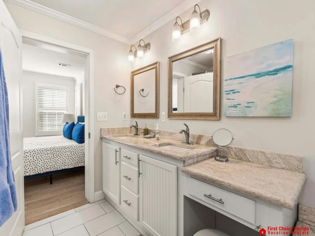 Bright, airy bathroom with dual sinks and elegant finishes