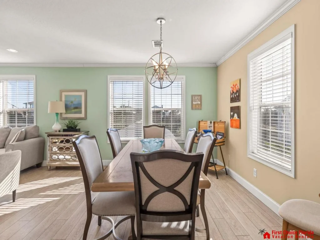 Sunlit dining room with cozy seating and elegant charm