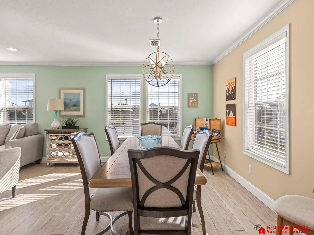 Sunlit dining room with cozy seating and elegant charm