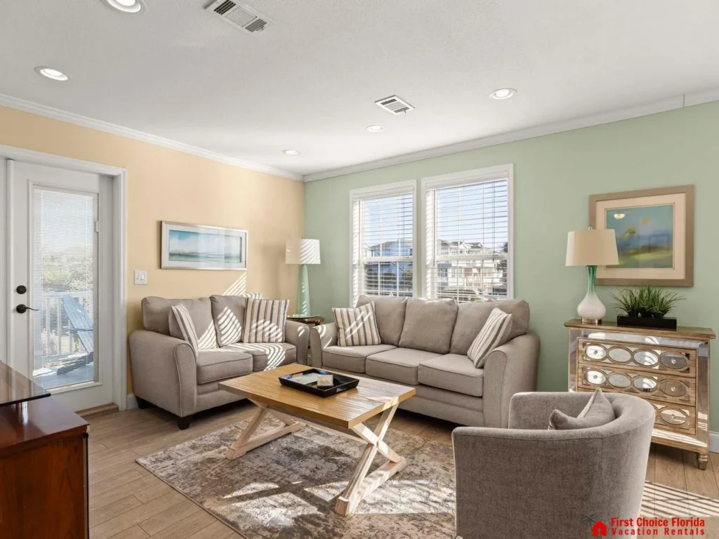 Sunlit living room with cozy seating and city views