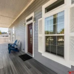 Spacious front porch with cozy seating for relaxing mornings
