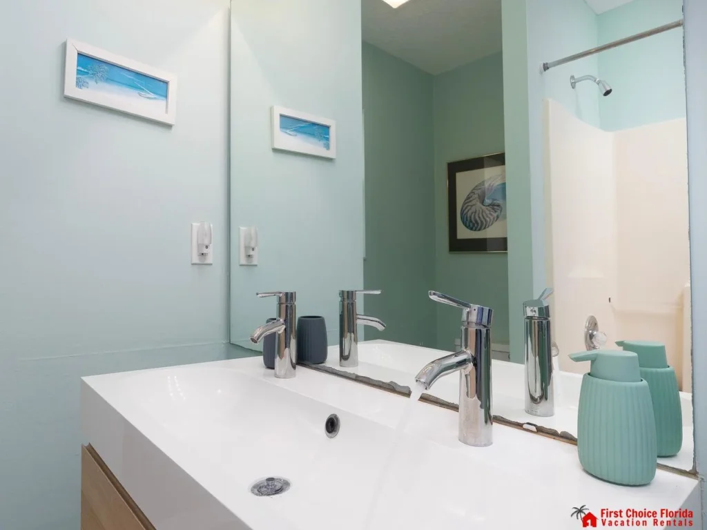 Bright, modern bathroom with sleek double vanity and shower