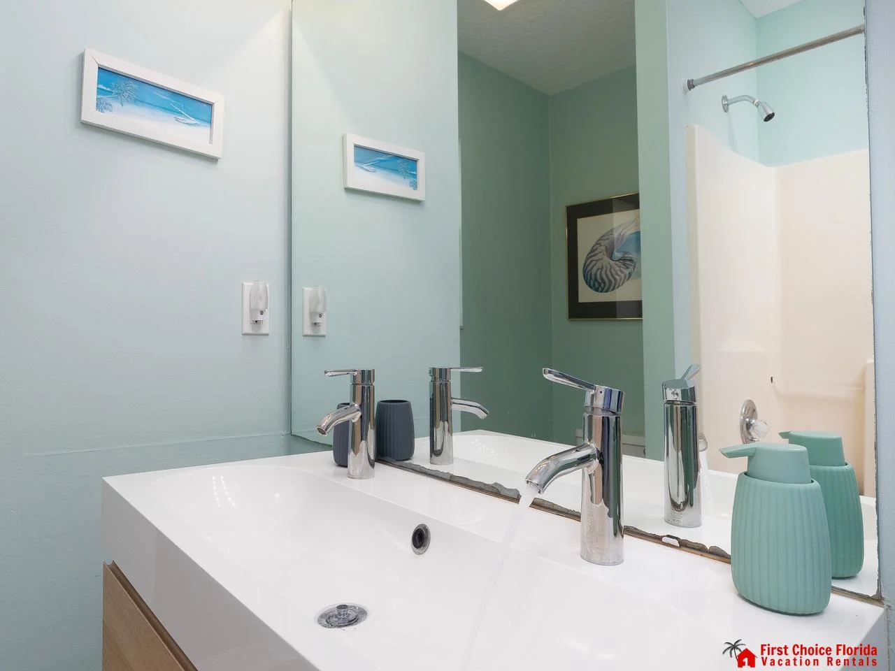 Bright, modern bathroom with sleek double vanity and shower