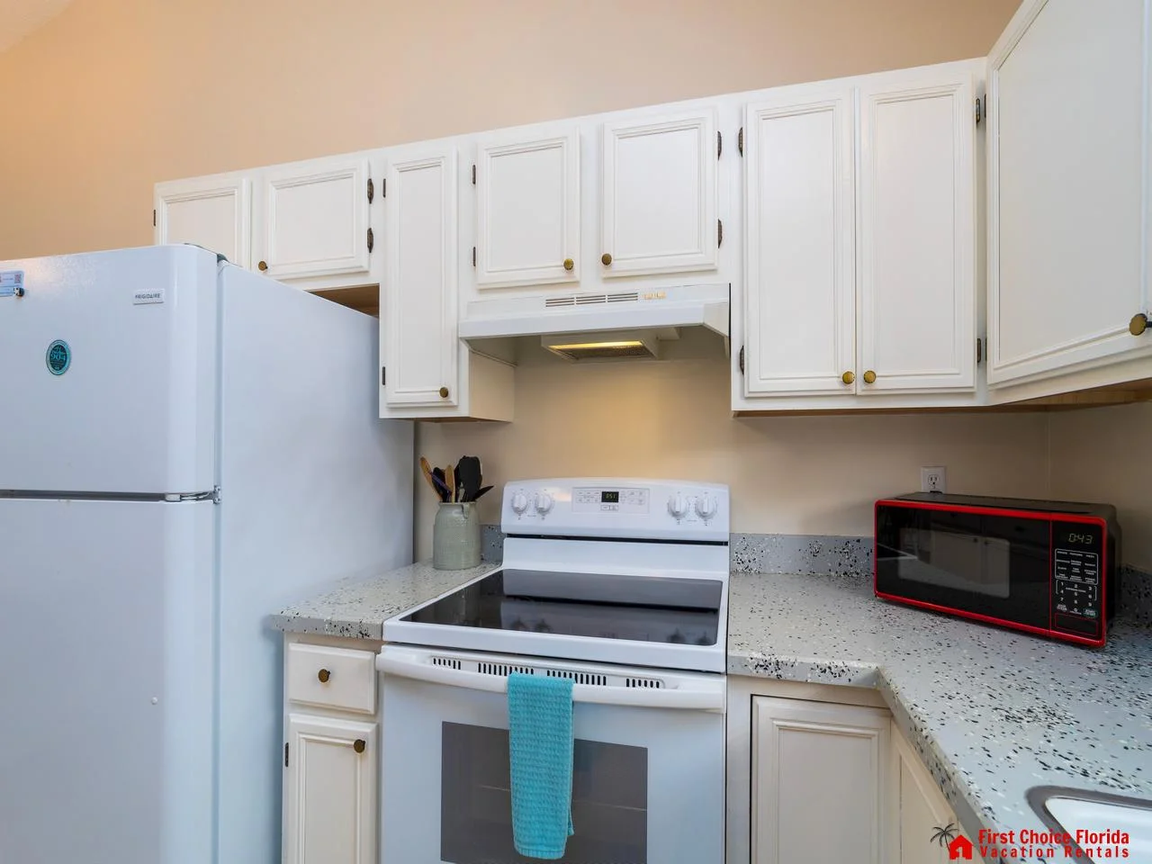 Bright, fully equipped kitchen with modern appliances and cozy charm