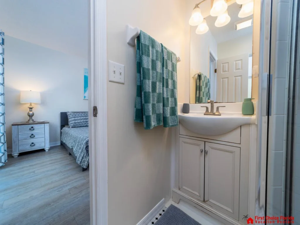 Cozy bathroom with bright vanity and soft towel accents