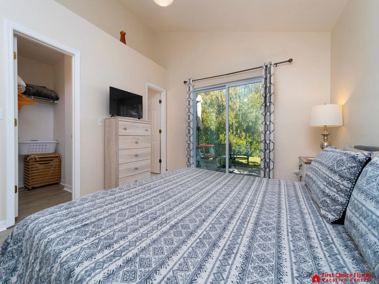 Bright bedroom with garden views and cozy linens