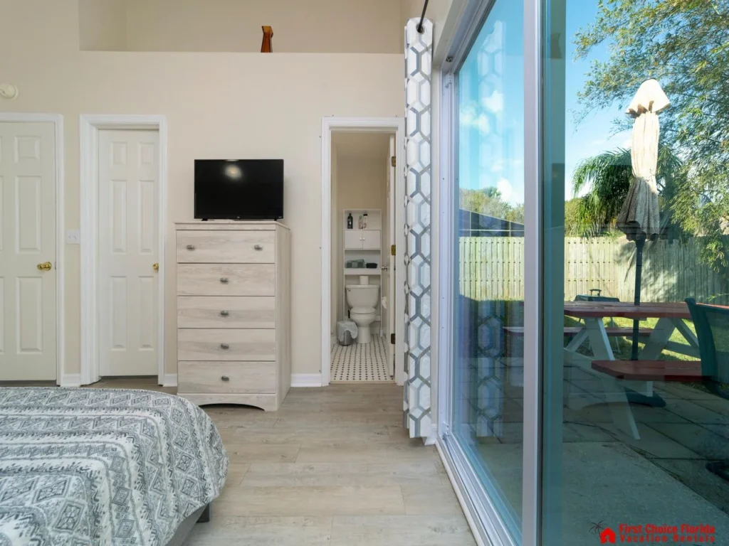 Bright bedroom with garden views and private patio access