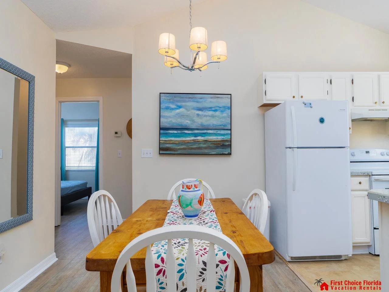Cozy dining area with charming farmhouse table and art