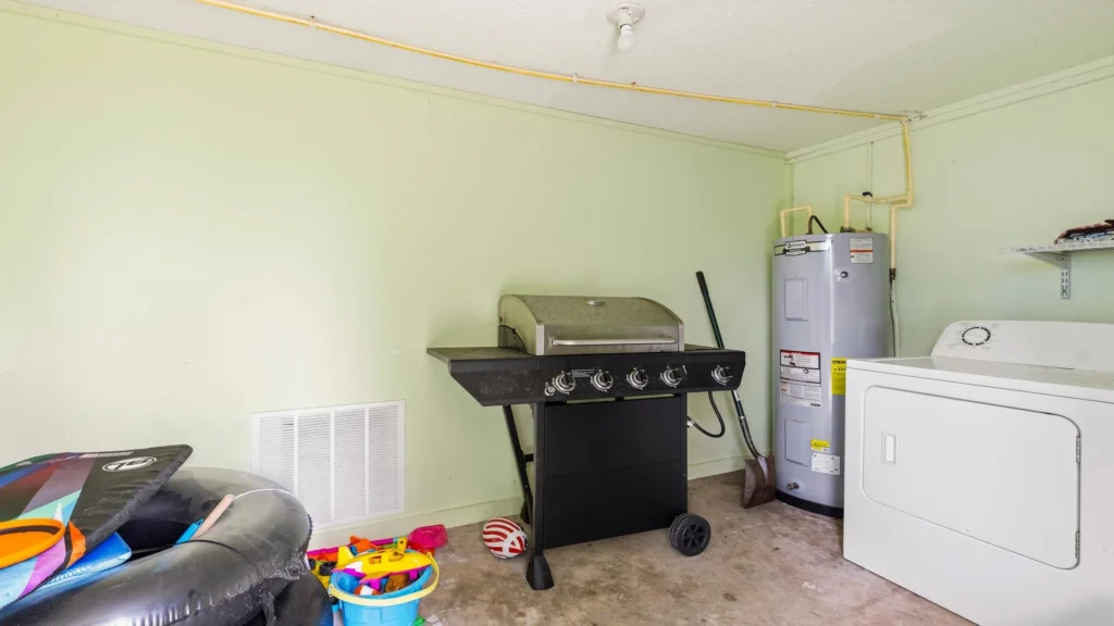 Laundry room inside the garage.