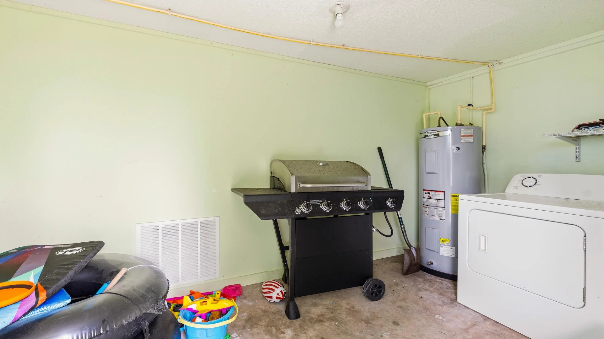 Laundry room inside the garage.