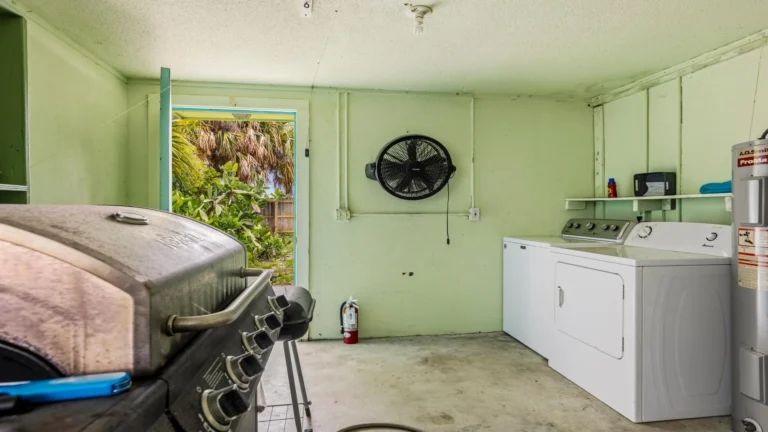 Laundry room inside the garage.