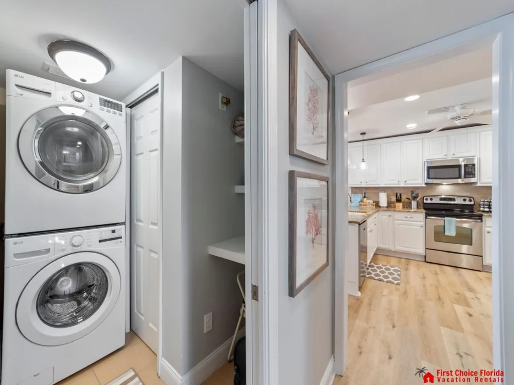Efficient laundry nook adjacent to a bright, modern kitchen