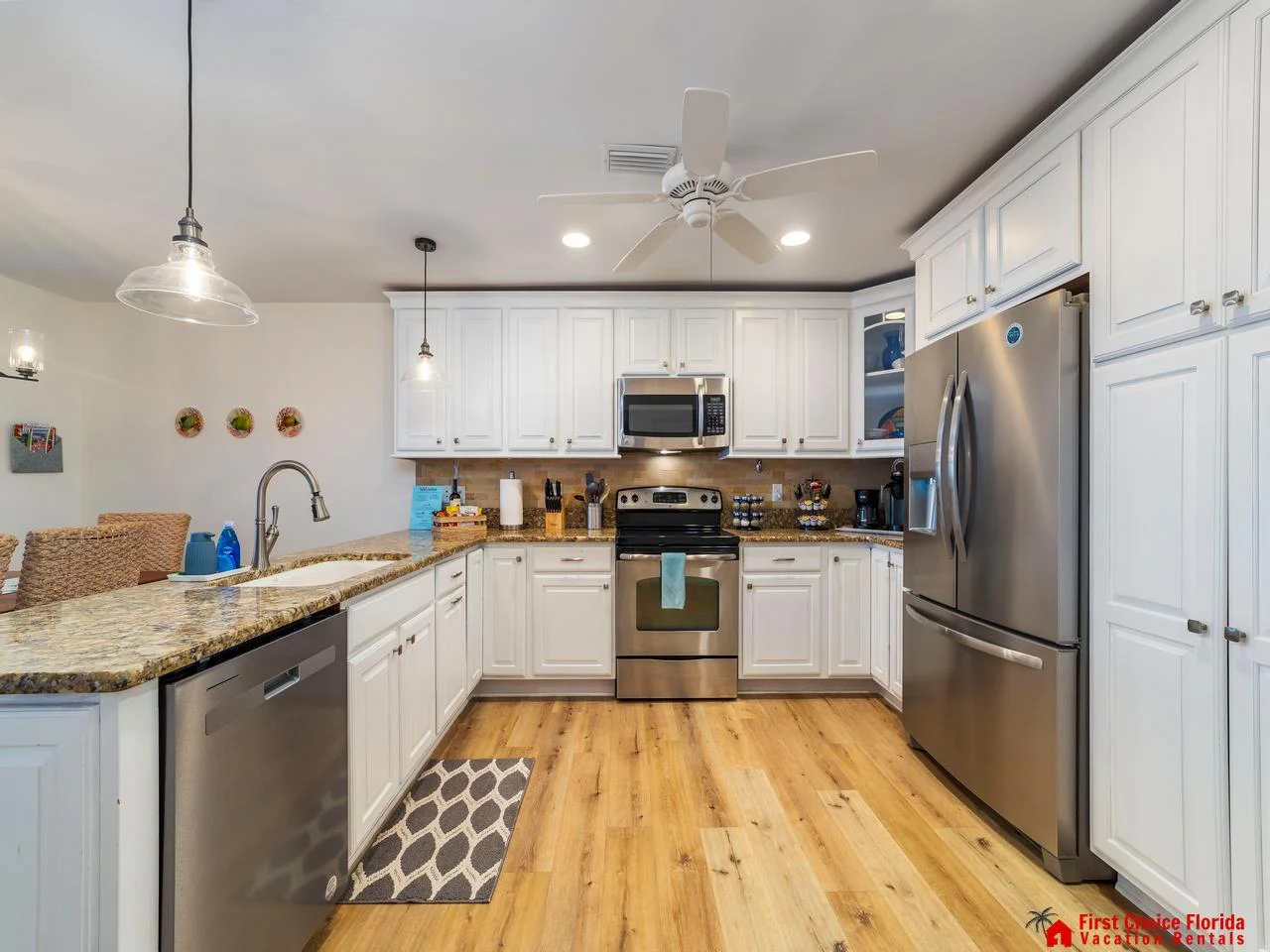 Bright, modern kitchen with stainless steel appliances and spacious countertops