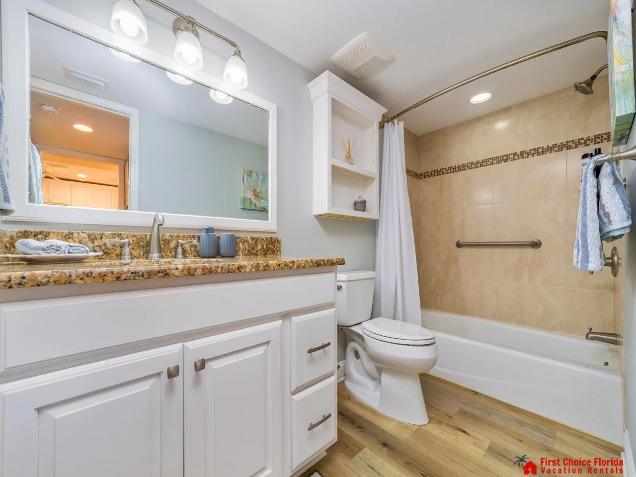 Bright, spacious guest bathroom with modern fixtures and tub-shower combo