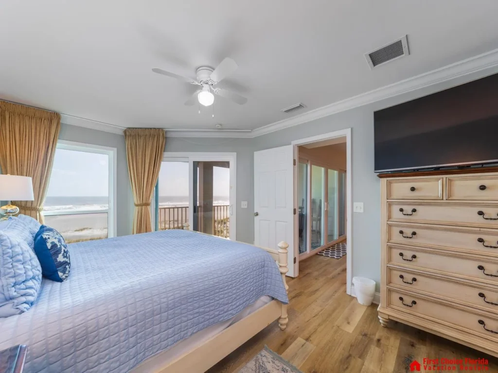 Bright and airy bedroom with ocean views and cozy decor