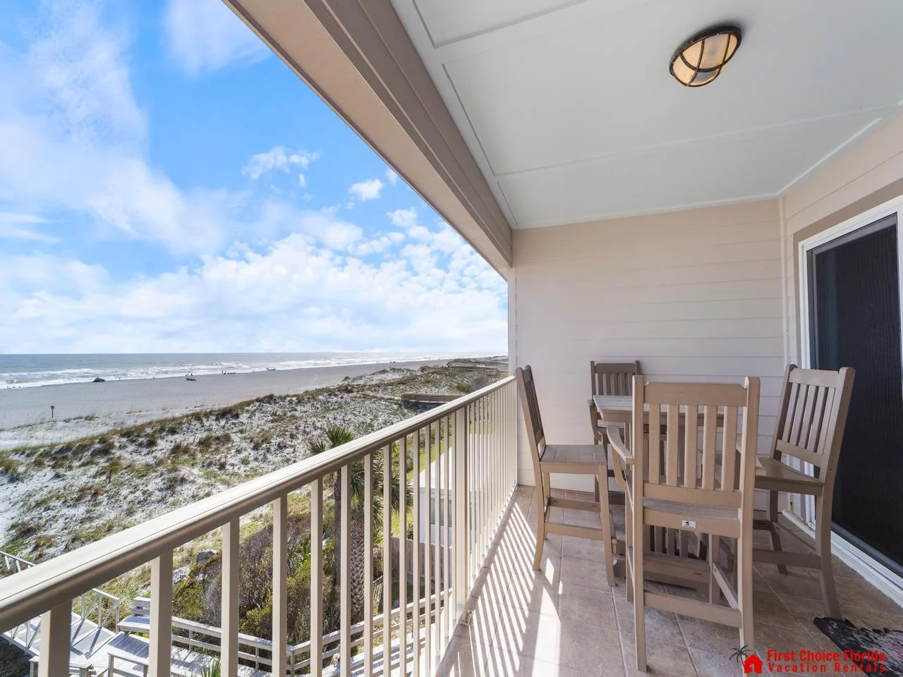 Oceanfront balcony with dining table and stunning sea views