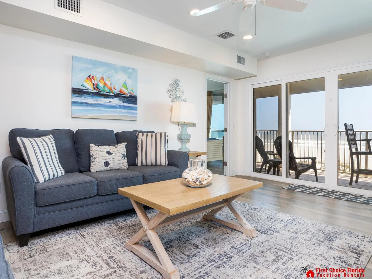 Cozy living room with ocean views and balcony access