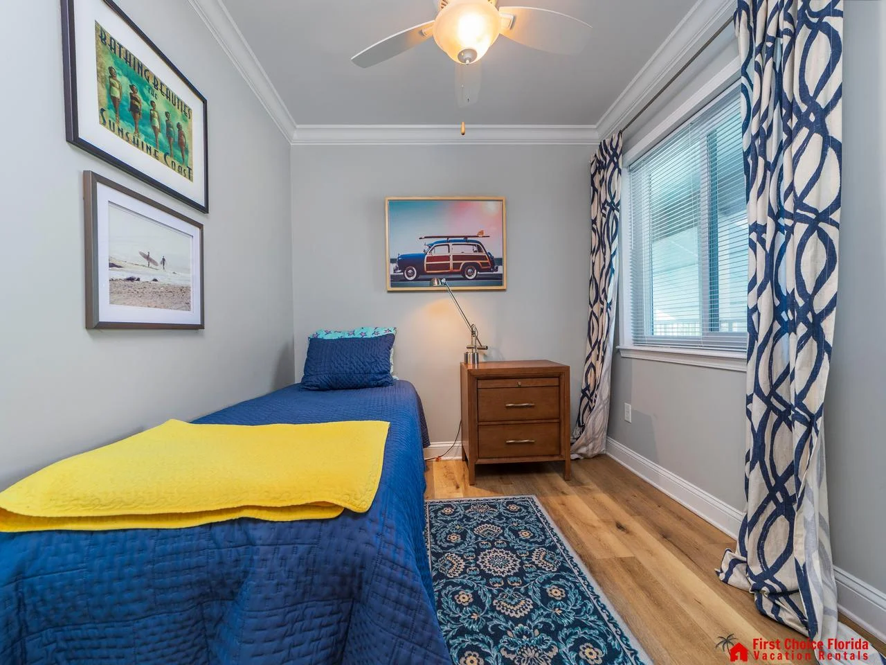 Cozy bedroom retreat with vibrant decor and natural light and two twin beds