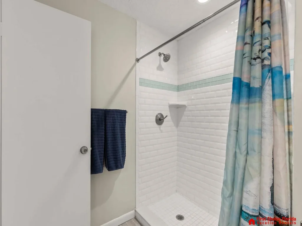 Bright, modern bathroom with spacious glass shower enclosure