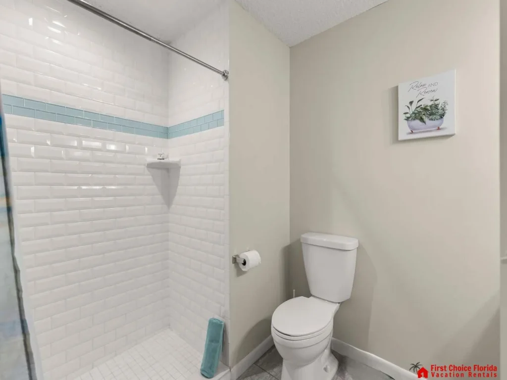 Bright, clean bathroom with modern subway tile shower