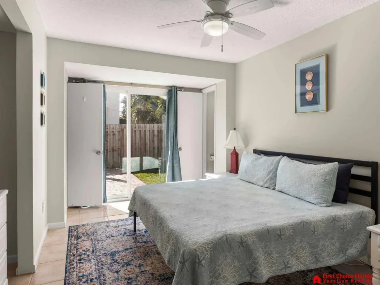 Bright bedroom with garden access and cozy ambiance