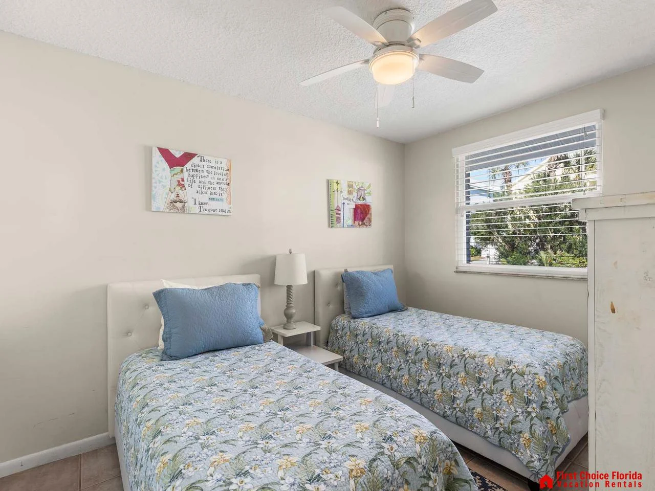 Cozy twin bedroom with bright natural light and calming decor