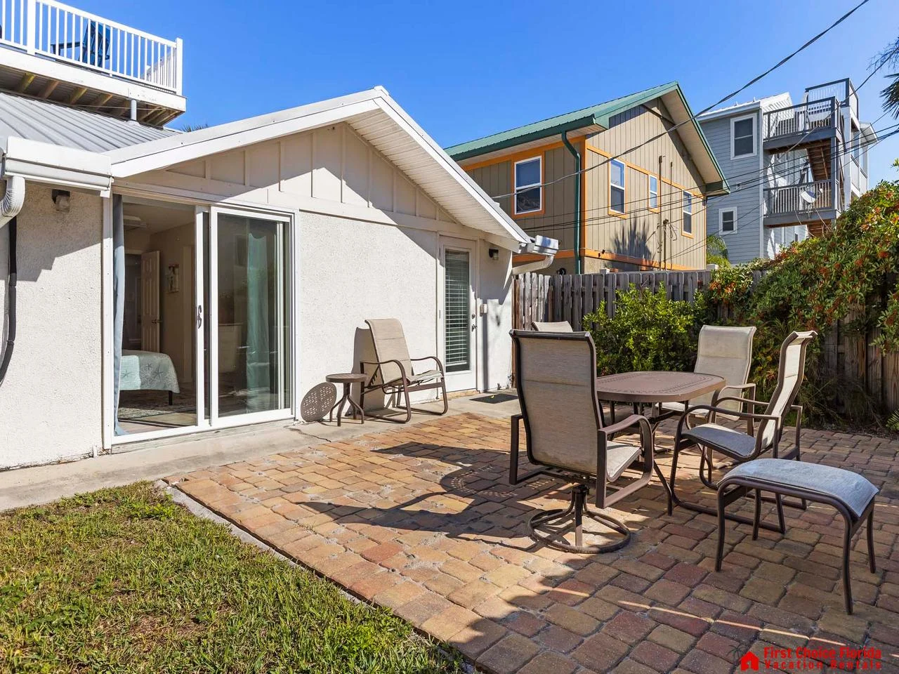 Sunny patio with cozy seating for outdoor gatherings - D Unit