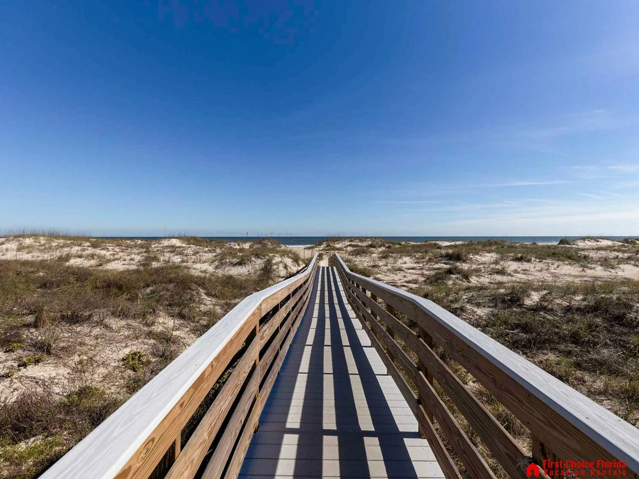 Scenic boardwalk leading to tranquil beach escape