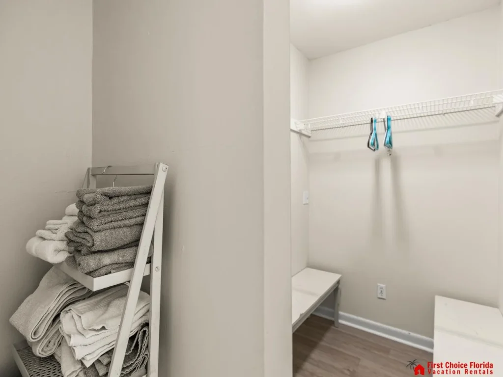 Cozy laundry nook with ample storage and fresh linens