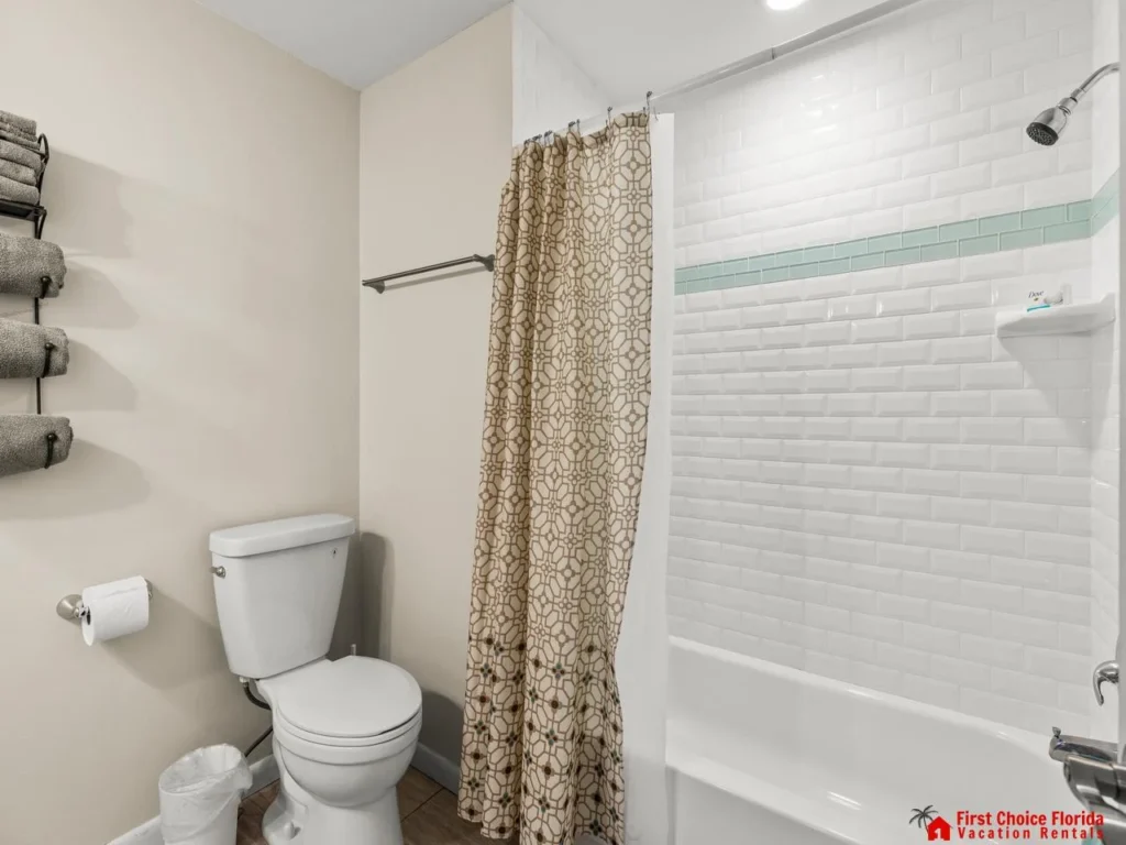 Bright, clean bathroom with modern shower and fresh towels