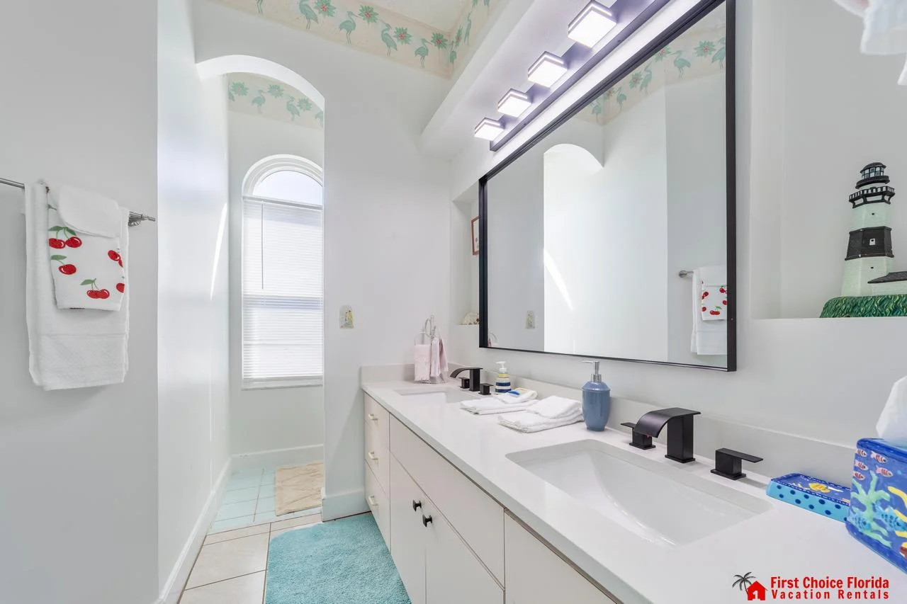 Bright, airy bathroom with dual sinks and natural light!