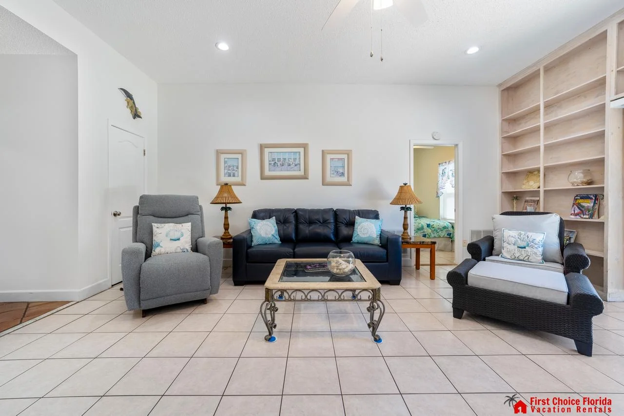 Spacious first floor living room with cozy seating and natural light!