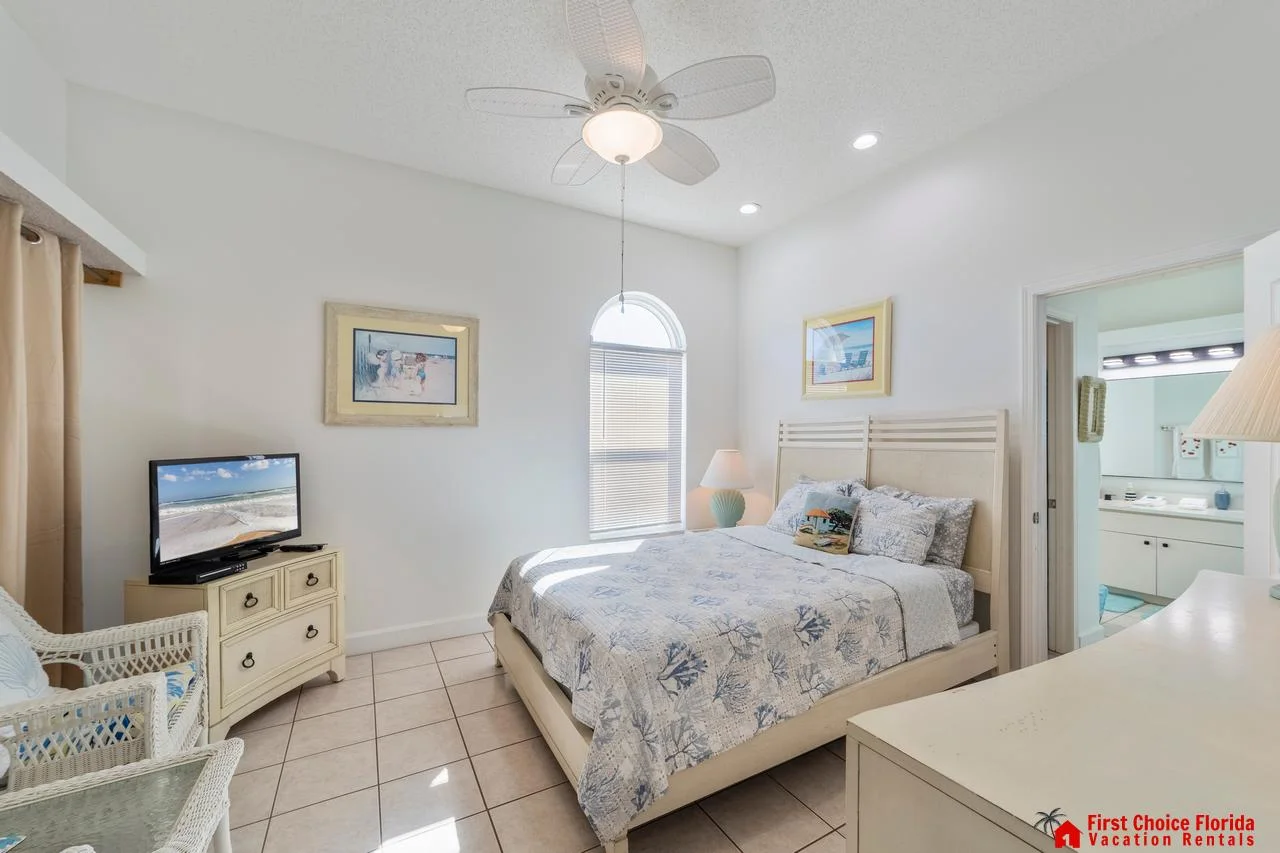 Bright and airy bedroom with cozy coastal charm and natural light!