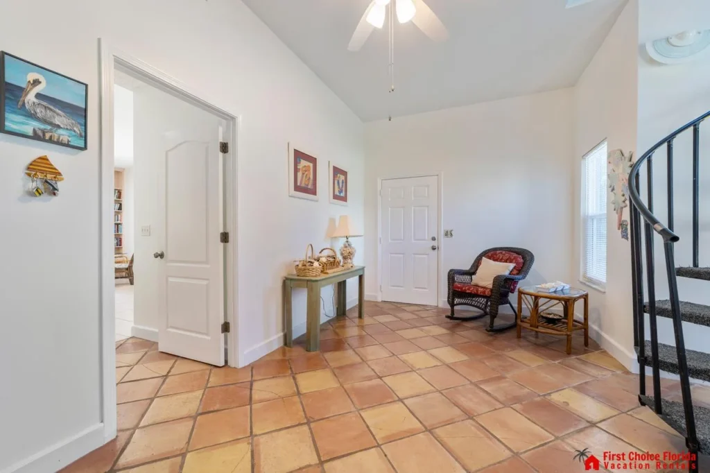 Bright and airy entryway with charming terracotta floors!
