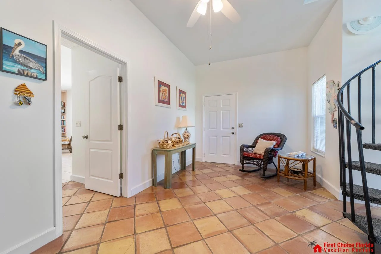 Bright and airy entryway with charming terracotta floors!