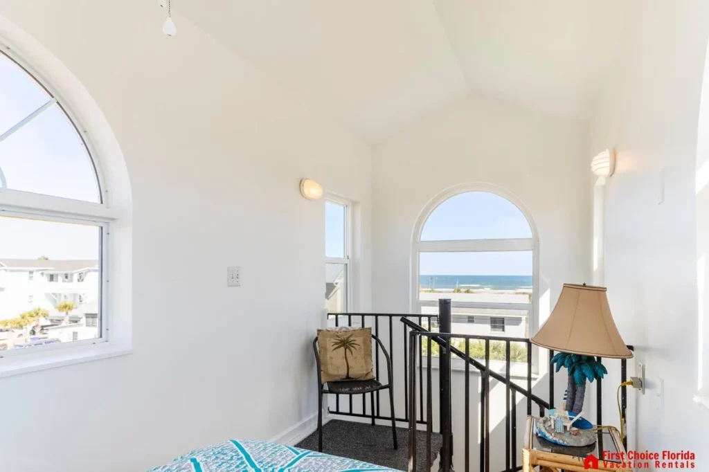 Bright sunroom with cozy seating and scenic window views!