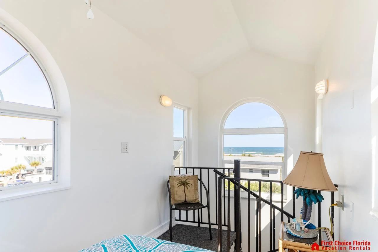 Bright sunroom with cozy seating and scenic window views!