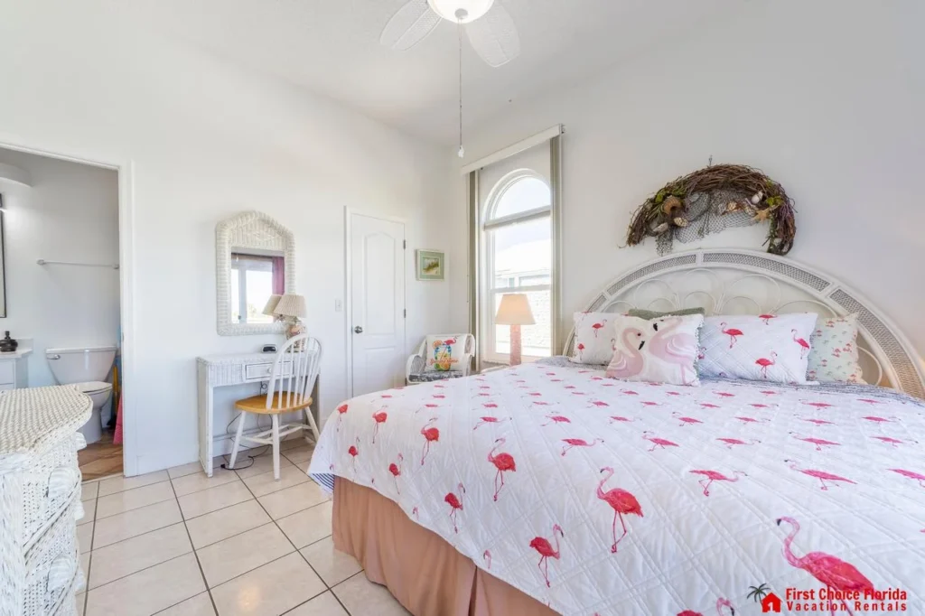 Bright and airy bedroom with charming coastal decor and natural light!