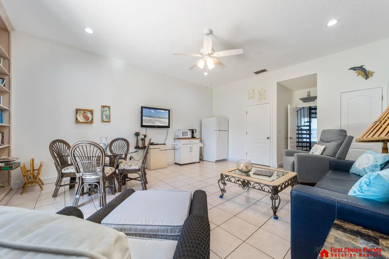 Bright and airy living room with cozy seating and dining area!