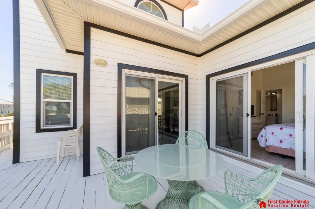 Sunlit patio with cozy seating, perfect for morning coffee!