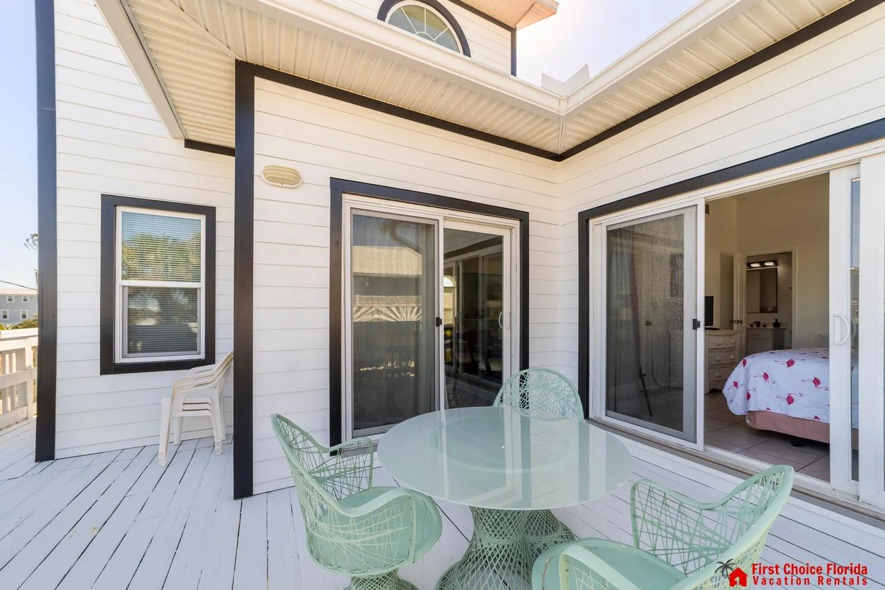 Sunlit patio with cozy seating, perfect for morning coffee!