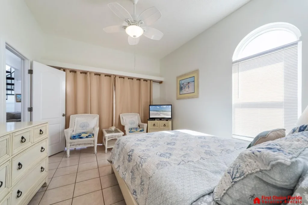 Bright and airy bedroom with cozy seating and natural light!