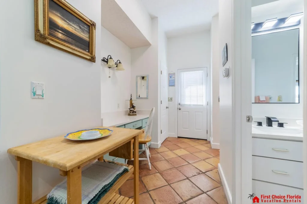 Bright entryway with rustic tile flooring and natural light!