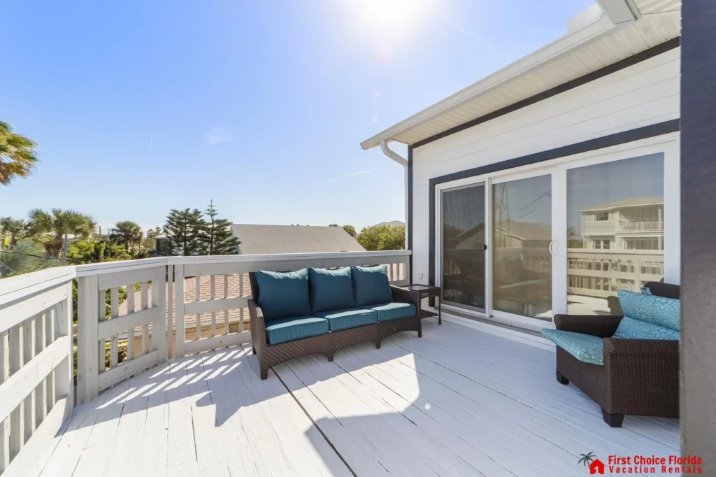 Sunlit balcony with cozy seating and scenic views!