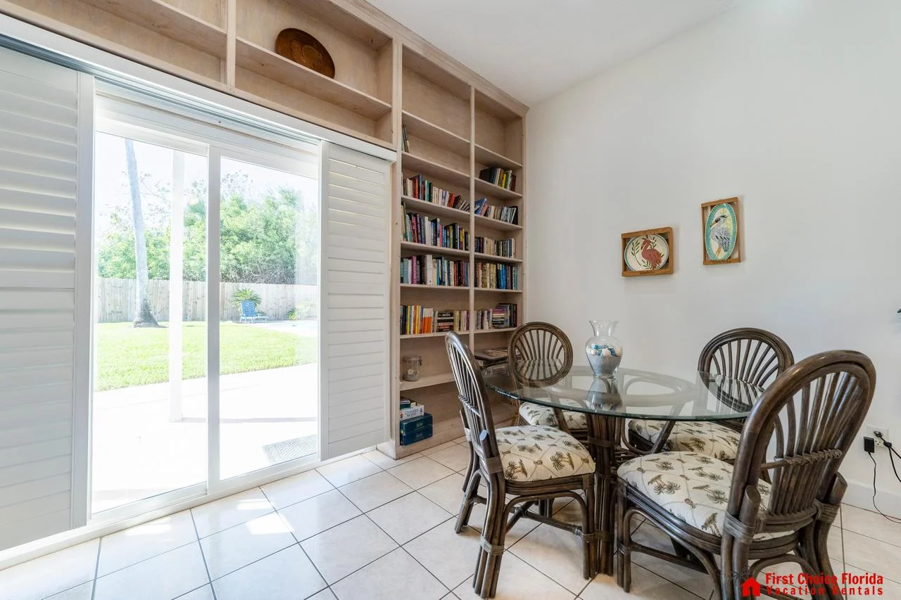 Sunlit dining nook on first floor with garden views and cozy charm!