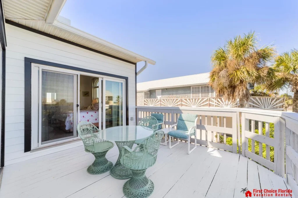 Sunny balcony retreat with cozy seating and ocean breeze views!