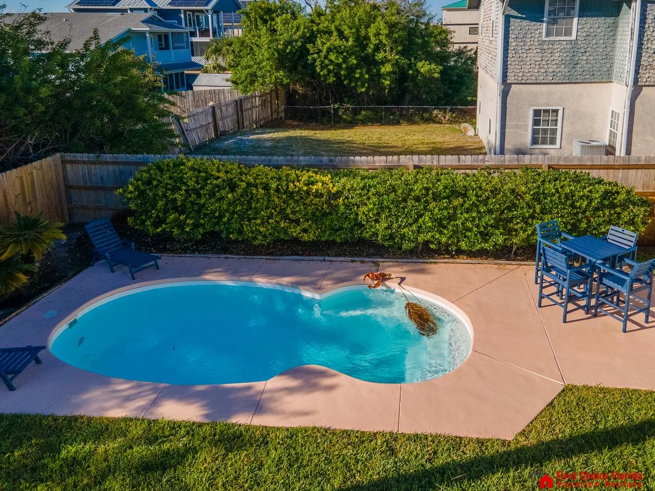 Private backyard pool with cozy seating for relaxation!