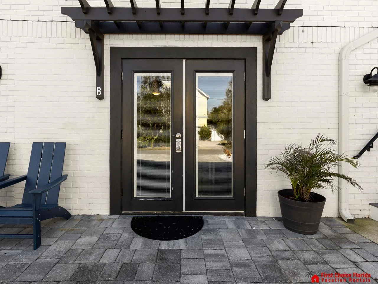 Charming front patio with cozy seating and welcoming entryway