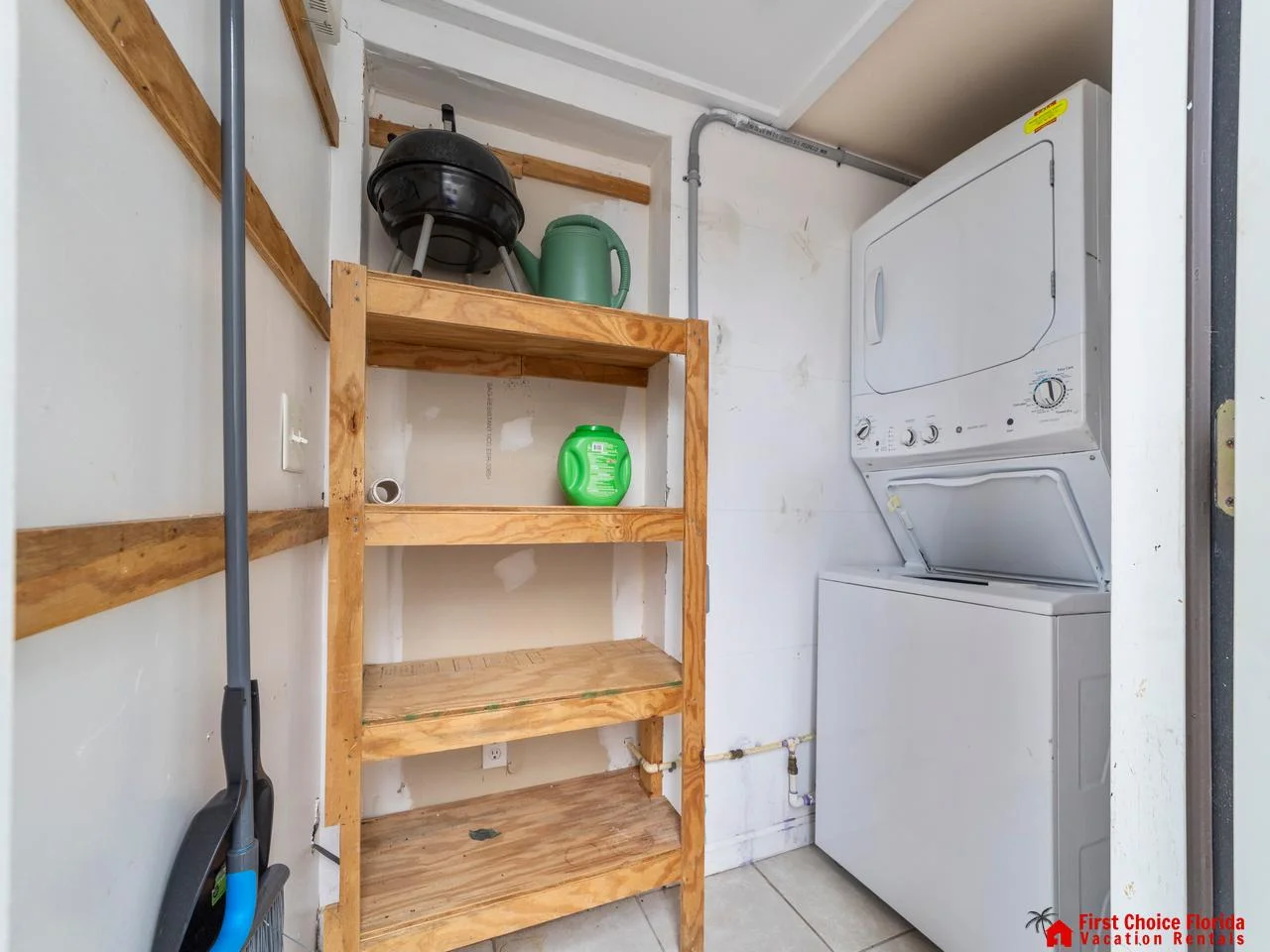 Compact laundry nook with stacked washer and dryer